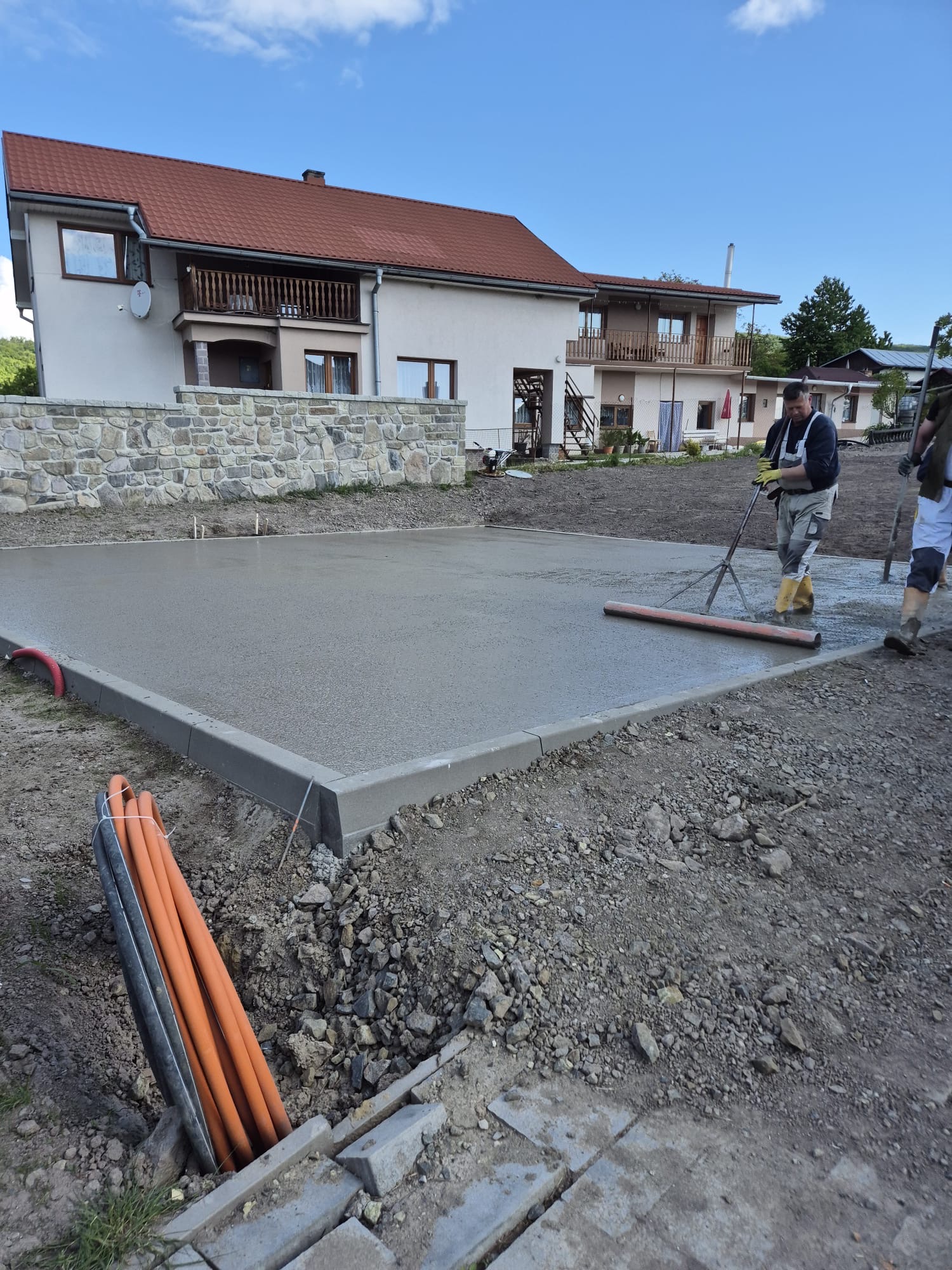 Poured foundation slab, screeded and finished on site.